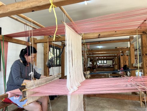 Women weaving silk scarf